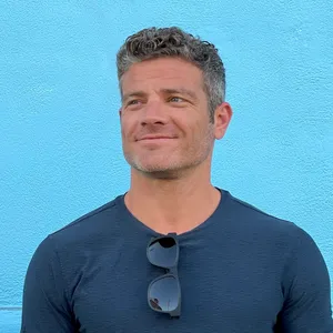 Brad Azevedo against a blue background